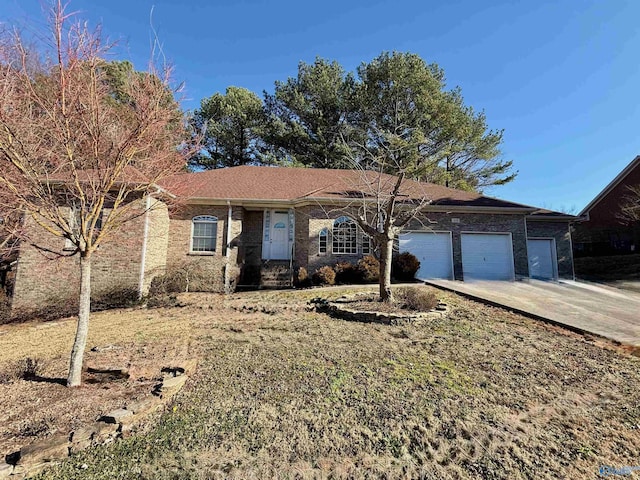 ranch-style home featuring brick siding, driveway, and an attached garage