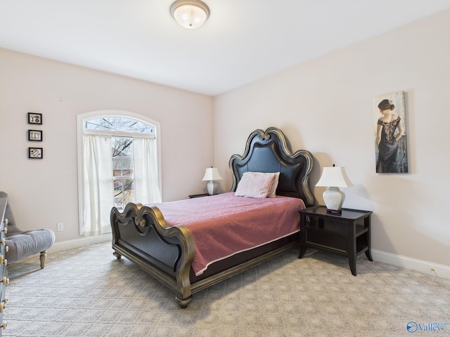 bedroom featuring carpet floors and baseboards