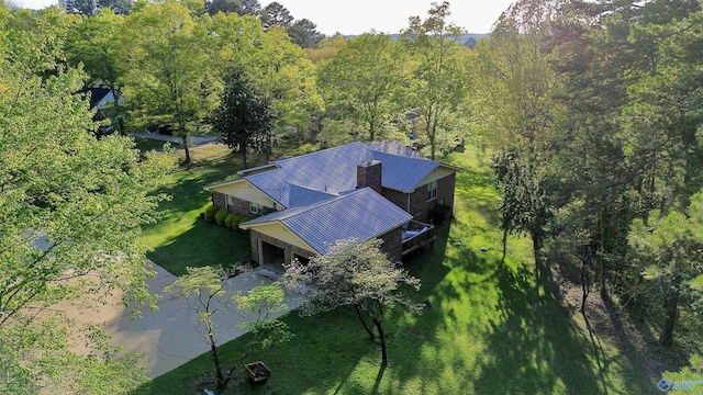 drone / aerial view featuring a view of trees