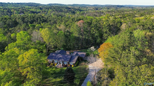 birds eye view of property with a forest view
