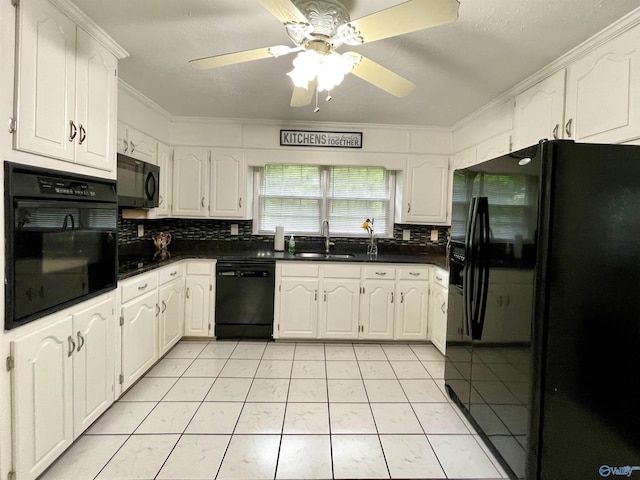 kitchen featuring black appliances, dark countertops, crown molding, and a sink