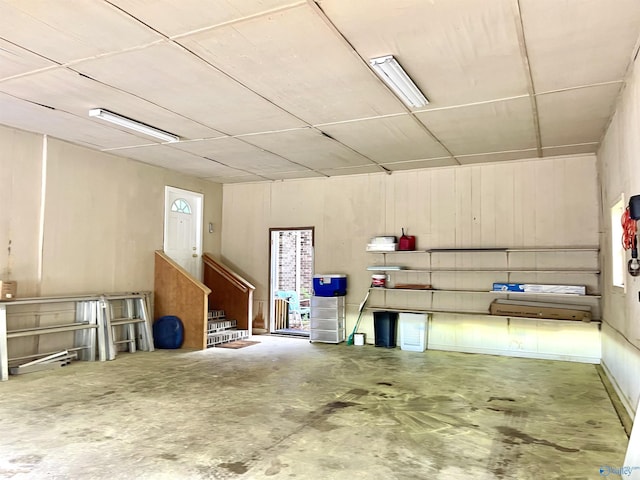 garage featuring wooden walls