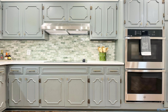 kitchen with backsplash, ventilation hood, double oven, and black electric cooktop