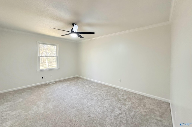 unfurnished room with ceiling fan, carpet floors, and ornamental molding