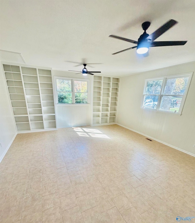 unfurnished room featuring ceiling fan