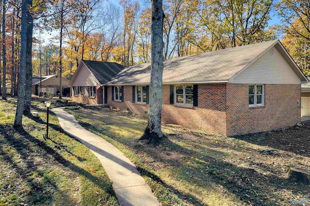 ranch-style home with a front lawn