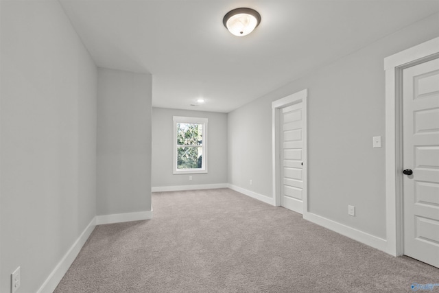 unfurnished bedroom featuring light colored carpet