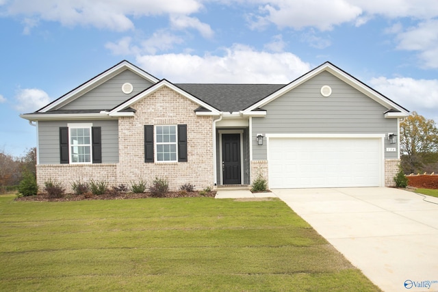 view of front of house with a garage and a front yard