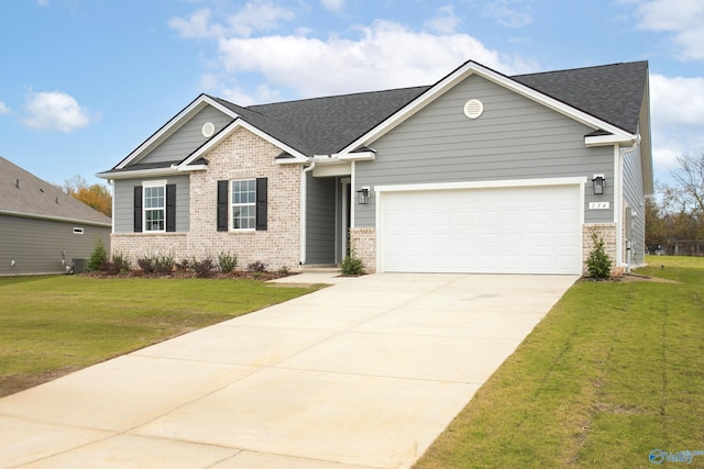 view of front of house with a garage and a front lawn