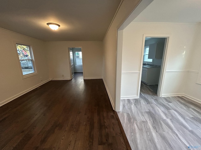 spare room with plenty of natural light and hardwood / wood-style flooring