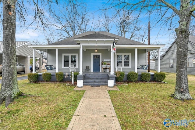 bungalow-style home featuring a porch and a front yard