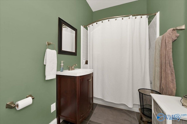 bathroom featuring vanity, tile patterned flooring, and shower / bath combination with curtain