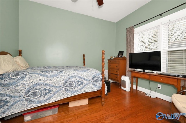 bedroom featuring ceiling fan and hardwood / wood-style flooring