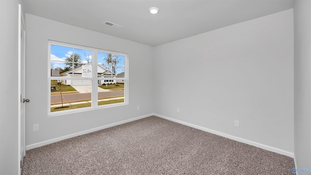 unfurnished room with carpet flooring