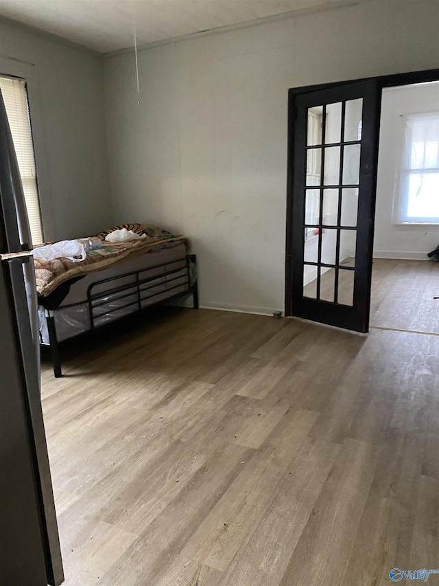 bedroom with light hardwood / wood-style flooring