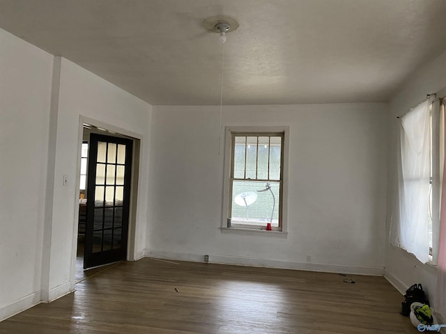 entryway with dark hardwood / wood-style flooring