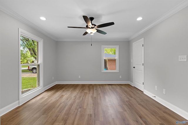 unfurnished room featuring wood finished floors, a ceiling fan, recessed lighting, baseboards, and ornamental molding