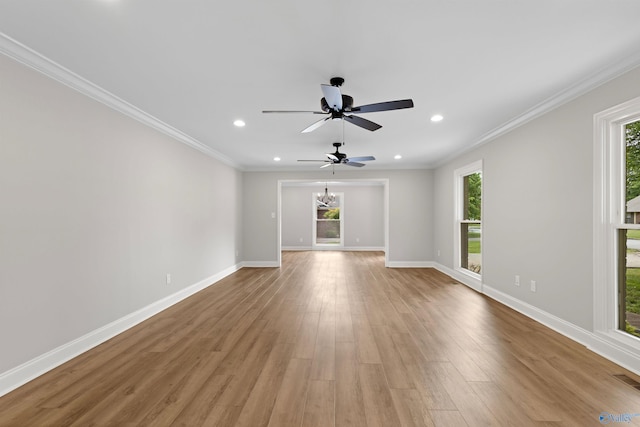 unfurnished living room featuring baseboards, ceiling fan, recessed lighting, light wood finished floors, and crown molding