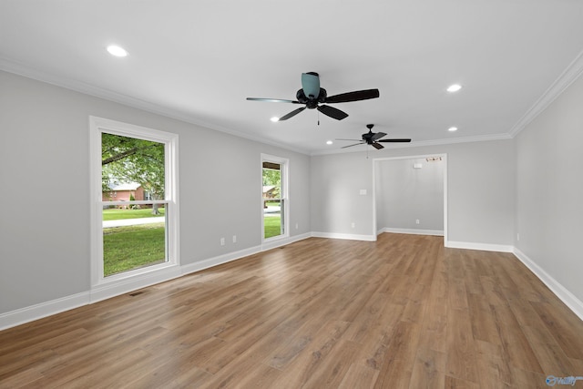 spare room with recessed lighting, light wood-type flooring, a ceiling fan, baseboards, and ornamental molding