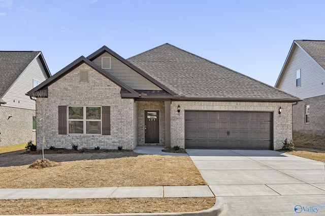 177 Pennington Ave, Huntsville, AL 35811 - view of front of home with a garage, driveway, roof with shingles, and brick siding