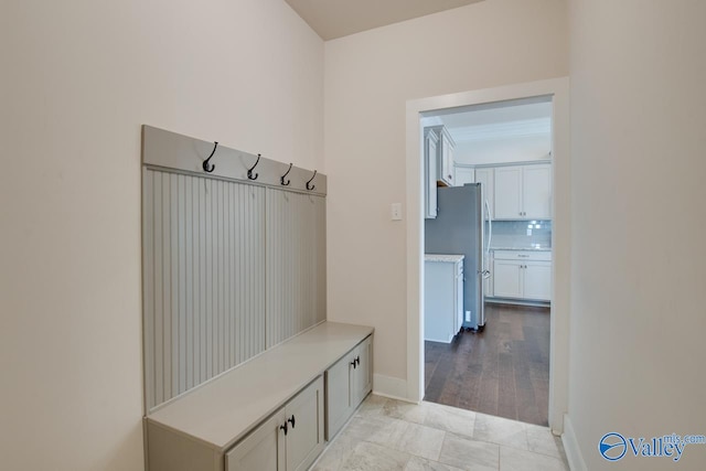 mudroom with light hardwood / wood-style flooring