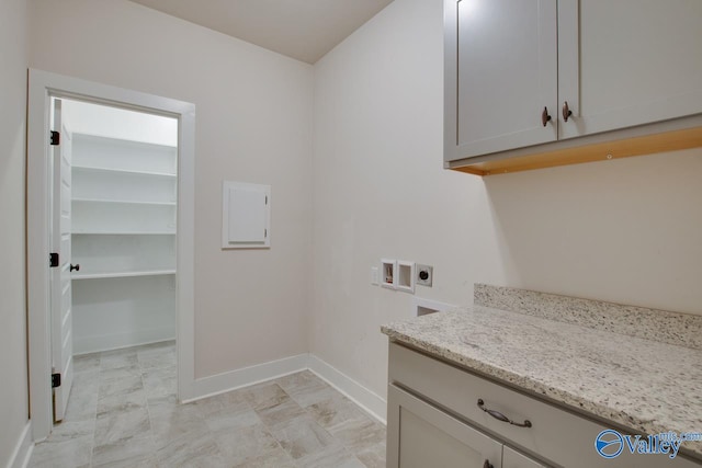 laundry room featuring cabinets, washer hookup, and hookup for an electric dryer