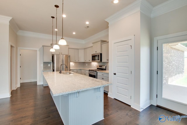 kitchen with stainless steel appliances, light stone countertops, pendant lighting, and dark hardwood / wood-style flooring