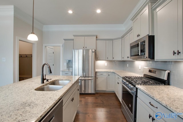 kitchen featuring light stone countertops, crown molding, sink, and appliances with stainless steel finishes