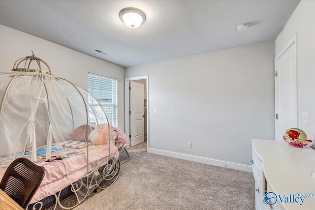 bedroom featuring baseboards, visible vents, and light carpet