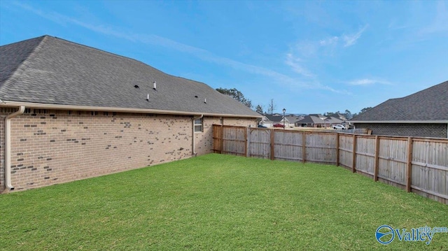 view of yard with a fenced backyard