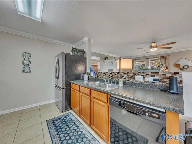 kitchen with ornamental molding, freestanding refrigerator, black dishwasher, decorative backsplash, and a sink