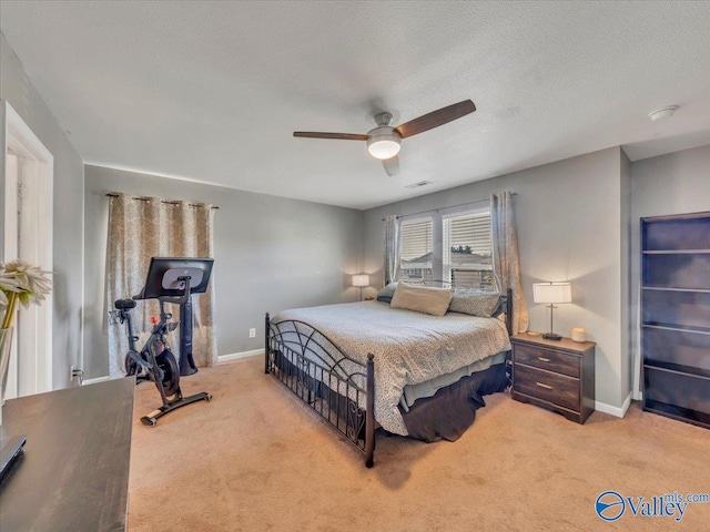 bedroom with visible vents, ceiling fan, baseboards, and carpet