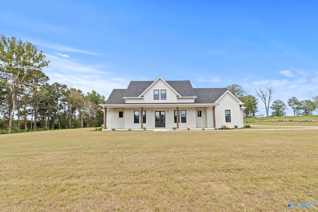 view of front of property featuring covered porch and a front lawn