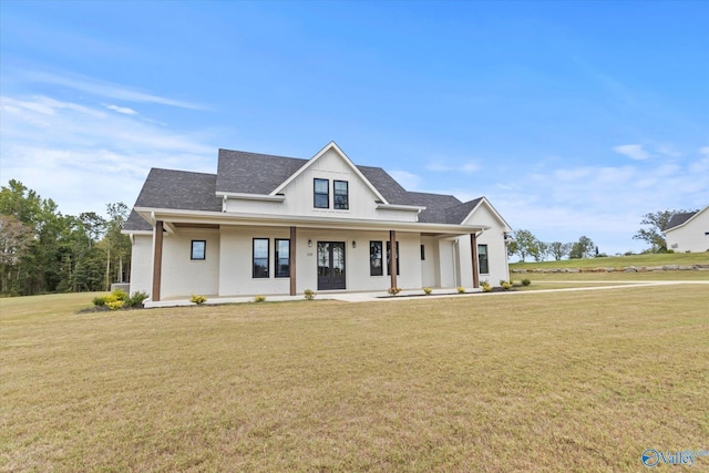 modern inspired farmhouse with a front yard and a porch