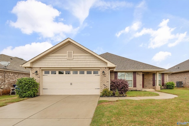 single story home with a front yard, brick siding, an attached garage, central air condition unit, and driveway