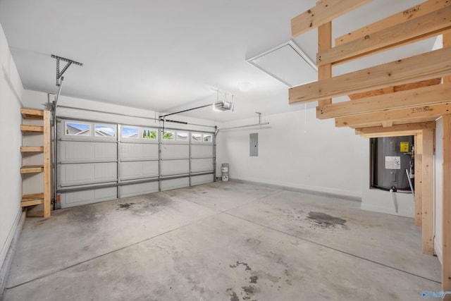 garage featuring baseboards, a garage door opener, and electric panel