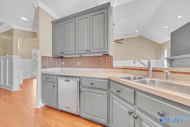 kitchen with dishwasher, light wood-style floors, ornamental molding, and gray cabinetry