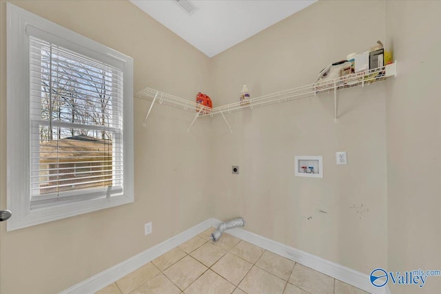 laundry room featuring a wealth of natural light, hookup for a washing machine, laundry area, and hookup for an electric dryer
