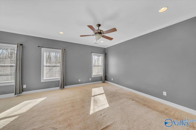 carpeted empty room featuring baseboards, ceiling fan, recessed lighting, and crown molding