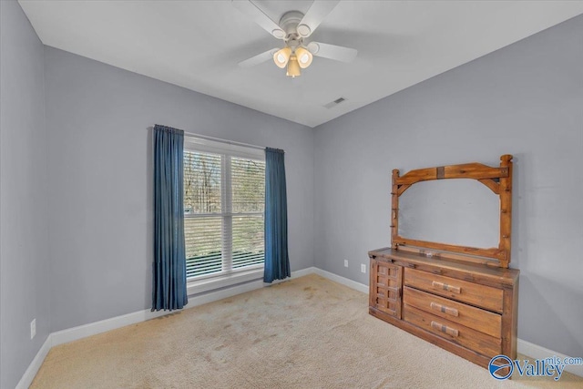 bedroom featuring baseboards, carpet floors, and a ceiling fan