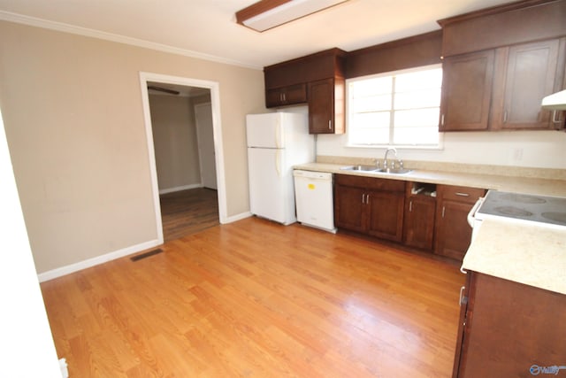 kitchen featuring crown molding, white appliances, light hardwood / wood-style floors, and sink