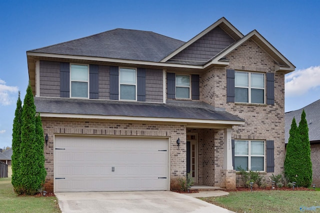 craftsman-style house with a garage and a front lawn