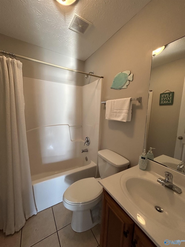 full bathroom with tile patterned floors, toilet, a textured ceiling, vanity, and shower / bath combo