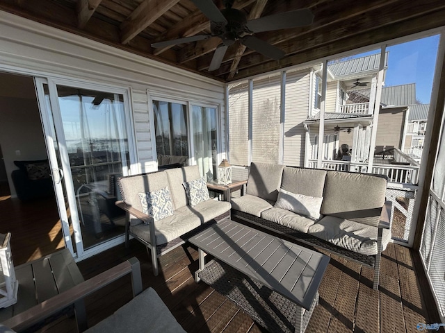 wooden terrace with outdoor lounge area and ceiling fan