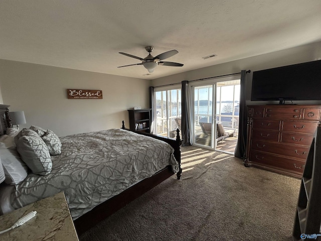 bedroom featuring ceiling fan, access to exterior, and carpet floors