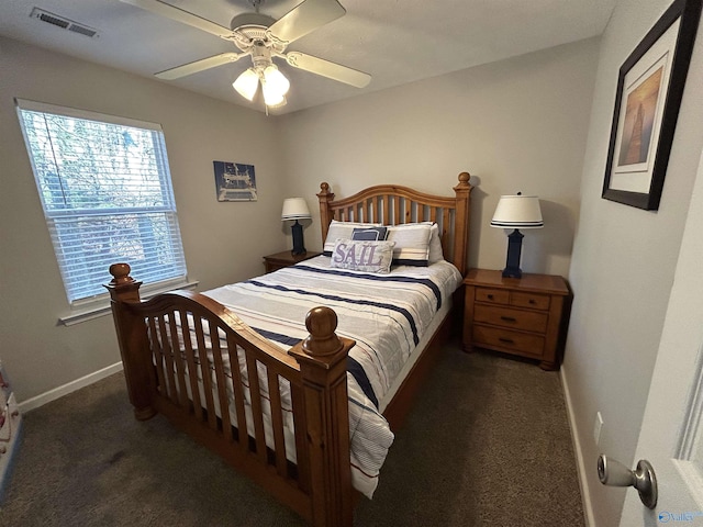 bedroom featuring dark colored carpet and ceiling fan