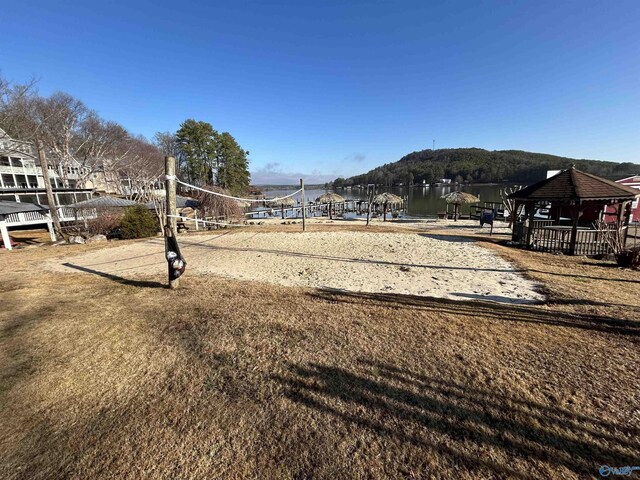 view of yard featuring a gazebo, a mountain view, and volleyball court