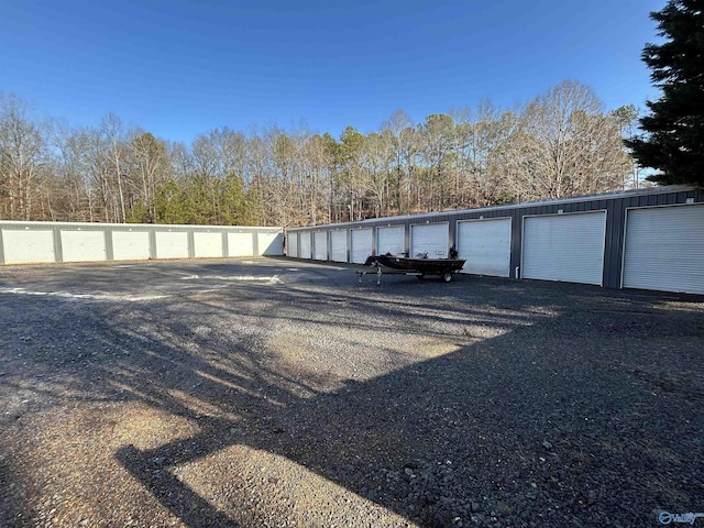 view of car parking with a garage