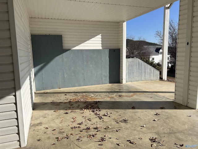 exterior space with a carport