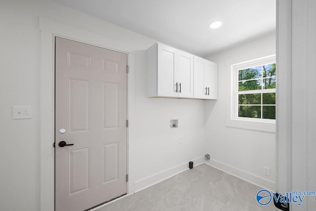 washroom with cabinet space, hookup for a washing machine, baseboards, and recessed lighting
